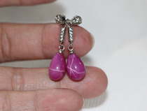 The red starred gemstone earrings that have been collected.