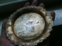 Fine stainless steel for a small saucer.