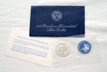 1974 US Eisenhower Pure Silver $1 with a collection certificate and an envelope