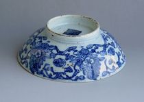 Ancient play of miscellaneous pieces of old objects with green flower tangled branches