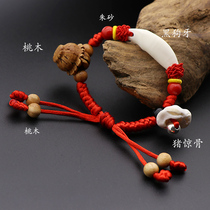 Baby baby real black dog teeth Peach core pig shock bone Peach wood string Children Ox bracelet Red rope anklet Genus Cow jewelry
