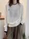 Suéter 100% de lana merino para mujer en otoño e invierno nuevo suéter de cuello redondo europeo con base de cachemira suéter de punto falso de dos piezas