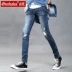 Quần jeans nam mùa thu Gurbaks phiên bản Hàn Quốc của quần thời trang Slim quần nam có lỗ thun nam quần jeans nam Quần jean