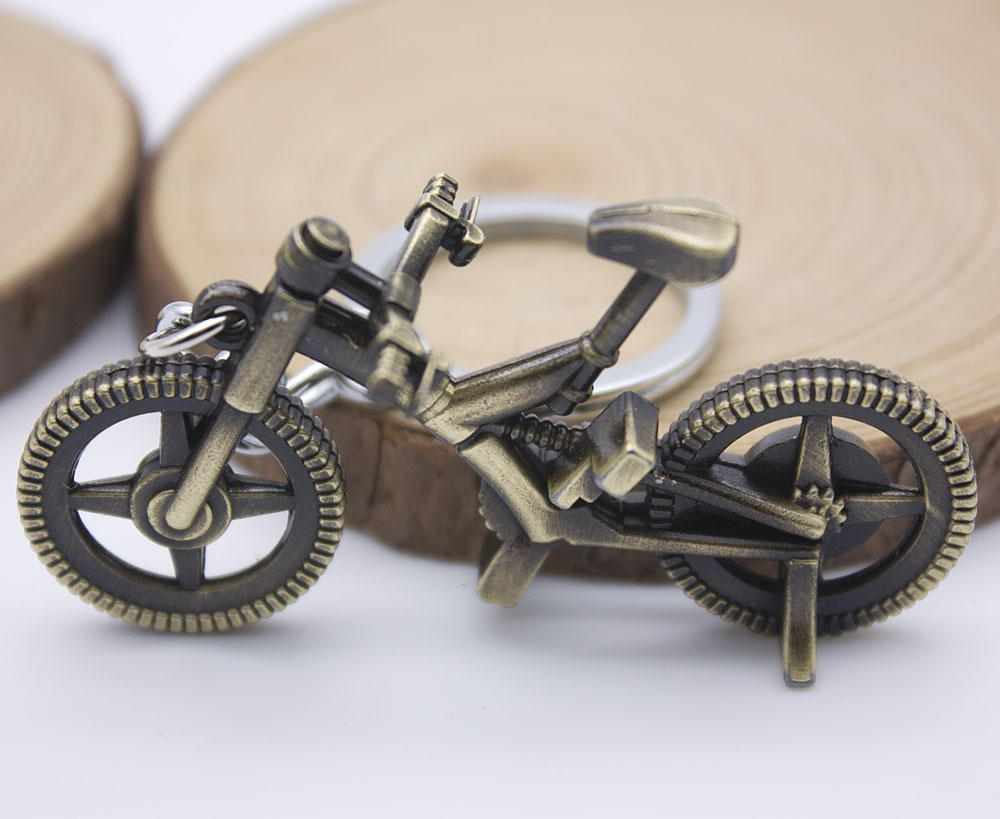 Mini bicycle keys are keys to the handle. Creative small gift handle can turn all metal