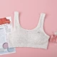 Phát triển đồ lót cô gái áo ngực áo vest nhỏ cô gái liền mạch màu cotton học sinh tiểu học và trung học cơ sở ống đầu quấn áo ngực - Ống