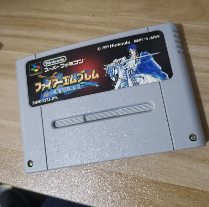 Nintendo SFC host applies the genuine game card with the flame's signature-the line of the genealogy flame of the jihad