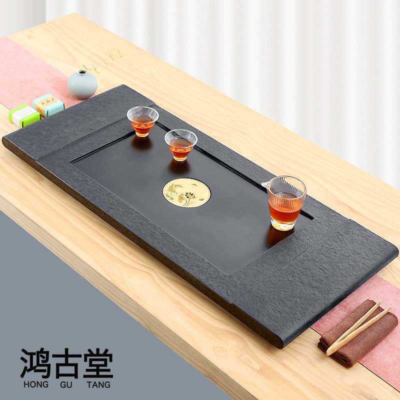 The whole piece of black gold stone tea tray home simple living room stone tea table Chinese style tea sea stone tea set Kung Fu tea tray