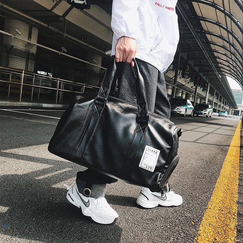 Hong Kong leather large capacity outdoor travel bag luggage bag men's multi-function fitness bag shoulder bag sports shoe bag tide