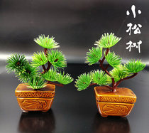 Funerary objects a pair of small pine trees a pair of ornaments a Shousong mourning hall a cemetery an ingot a burial crypt and an urn.