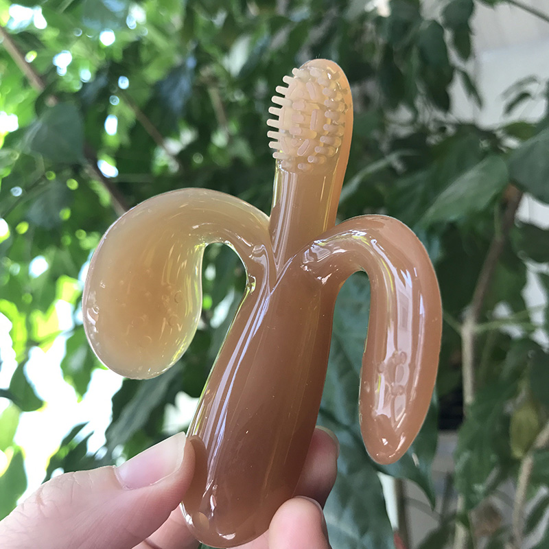 Best-selling American baby teether Banana Toothbrush Tooth fixer Nano silver silicone molar stick Baby bite bite glue