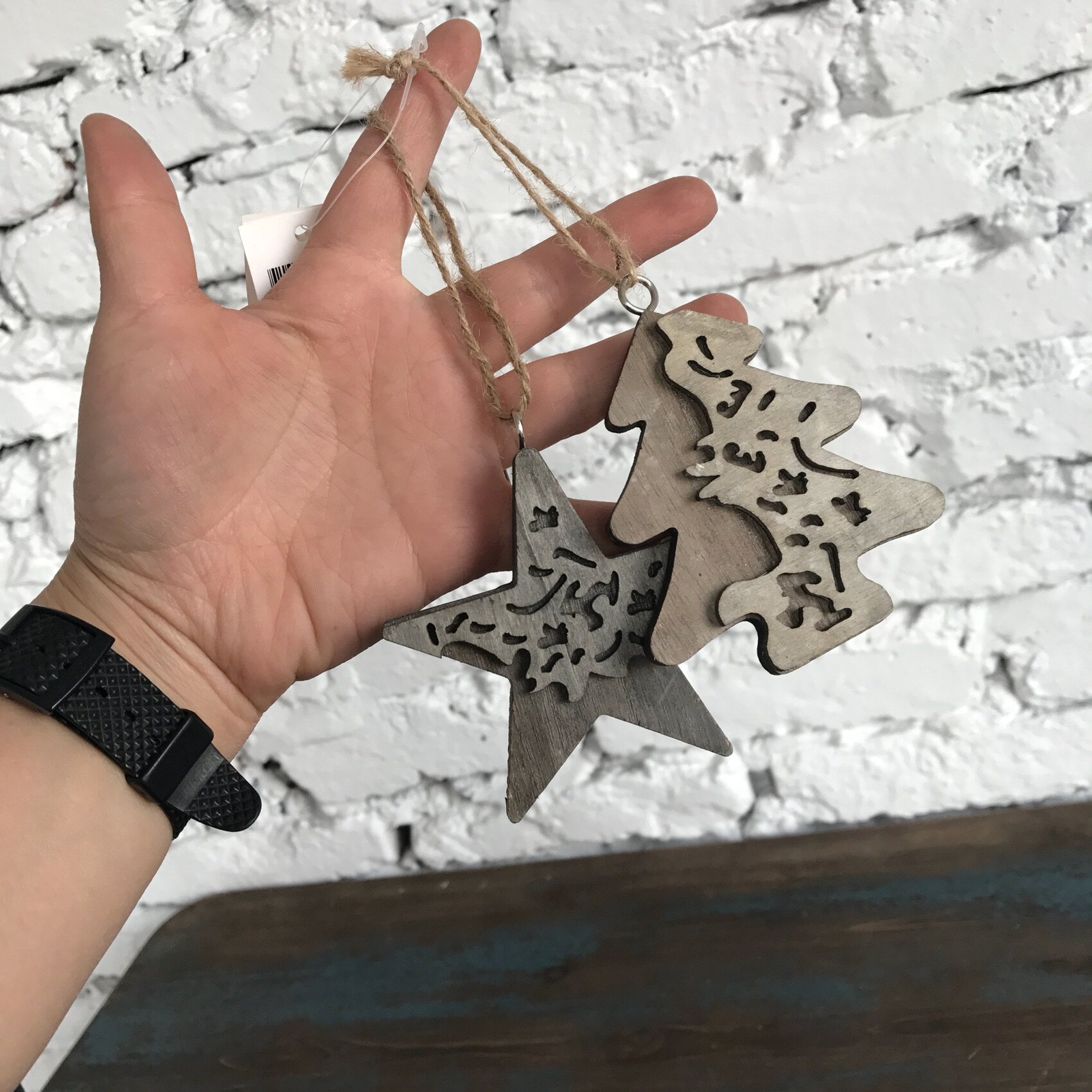 West-East foreign trade groceries Outside single wooden Christmas tree star decoration hanging wall