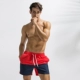 Tác động trực quan Mùa hè khâu màu quần nam bãi biển Quần short spa màu kích thước lớn - Quần bãi biển 	quần đi biển tập thể