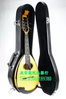 Современный музыкальный инструмент черный деревян