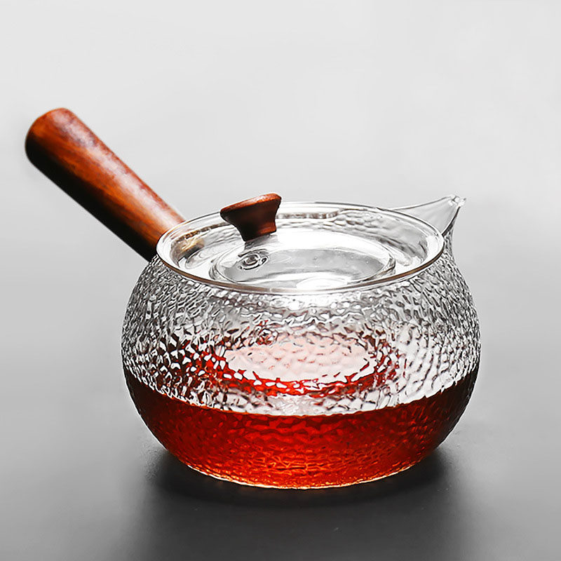 Heat resistant glass hammered foam teapot filter side to turn the cooking teapot solid wood to the torch Tao oven can be heated Kung Fu tea set