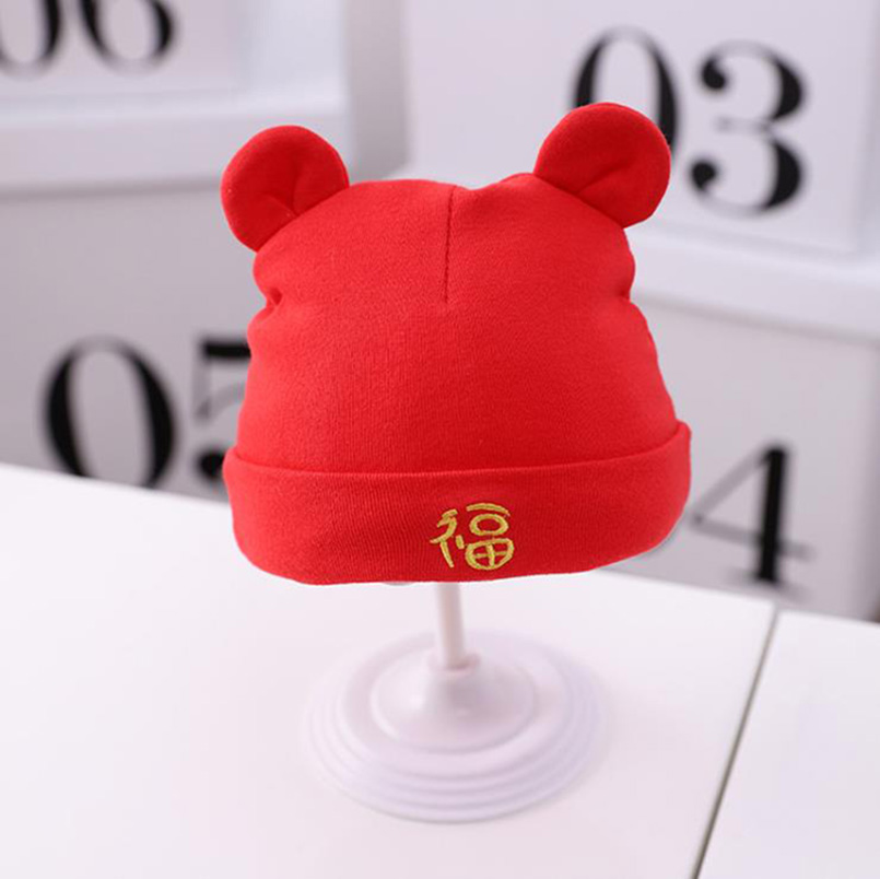 Newborn baby autumn and winter thickened big red festive blessing character tire hat male and female baby full moon hundred days pullover hat cute