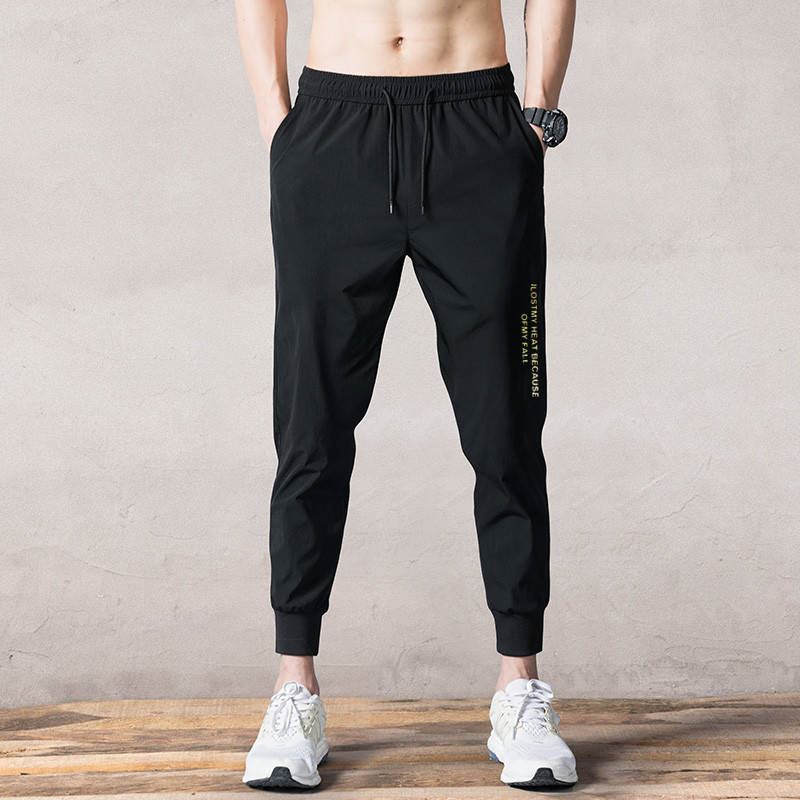 2020 Spring and autumn new casual pants men's and women's version with small feet elastic and thin sports pants loose with large size.