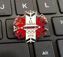 2010 Vancouver Winter Olympics badge Omega badge 1976 Innsbruck Winter Olympics snowflake badge