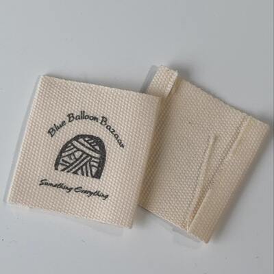 A woolen fabric label with a price of approximately 40mmx41mm