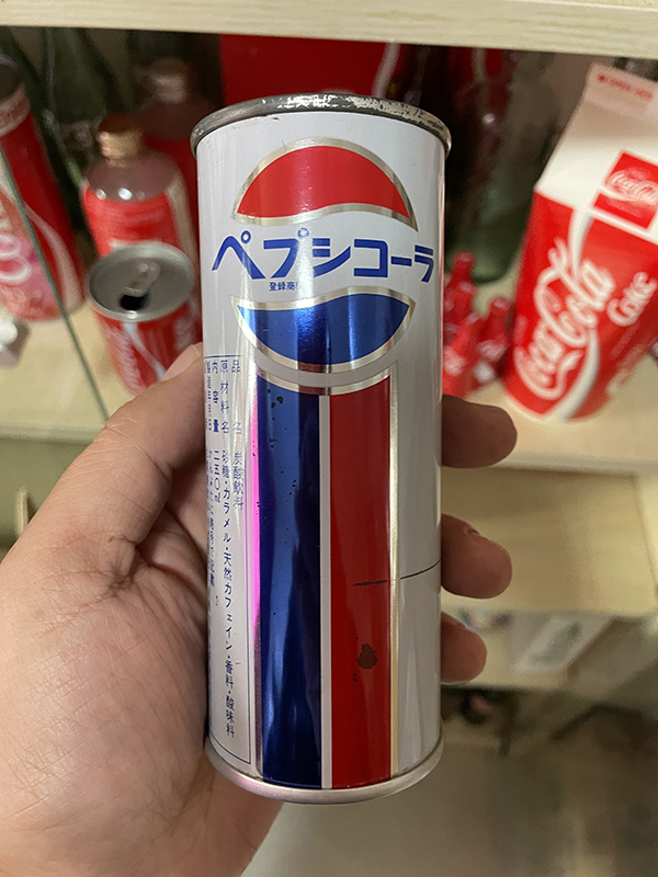 Collection of early Japanese Pepsi tinplate cans