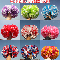 A cheerleading flower ball game with a cheerleading ball cheerleader a fancy ball school class bodybuilding and a dance prop.