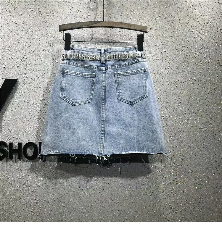 Châu Âu 2019 xuân hè hè nữ mới eo cao Một gói từ hông váy lông cạnh khoan nóng váy denim mỏng nữ - Váy