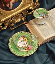 Beautifully colored British antique cups and saucers with interior painting from the 1800s