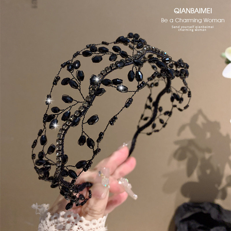 Hand-woven, luxurious black crystal branch headband with delicate mesh design, a new style for 2026.