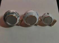 A set of golden mouth bird food cups