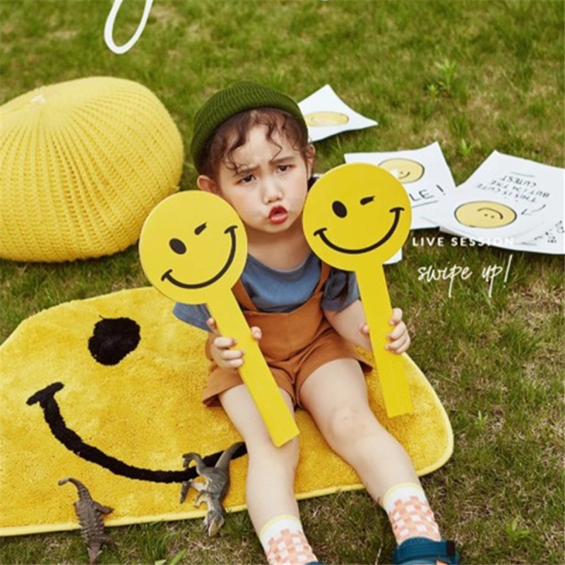 Children's creative photo yellow smiley hand holding board card baby theme photo blanket white tennis racket props