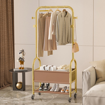 Light and luxurious floor hanger bedroom clothing cap rack with wheel movable headboard containing multifunctional double layer of clothes hanger