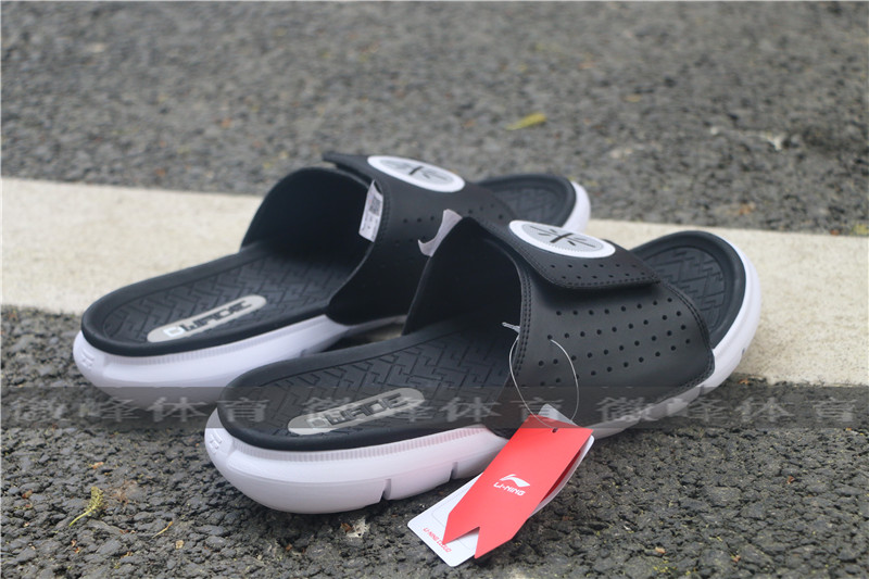 LINING Li Ning truy cập chính hãng Wade cách đàn ông sốc hấp thụ ánh sáng sân bóng rổ dép ABTN003 - Dép thể thao dép lacoste