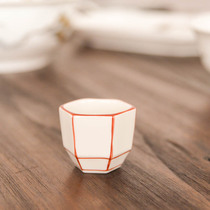 (B18) Day-style clear wine goblet with a small mouth cup ins and a fresh ceramic hexagonal small cup of tea