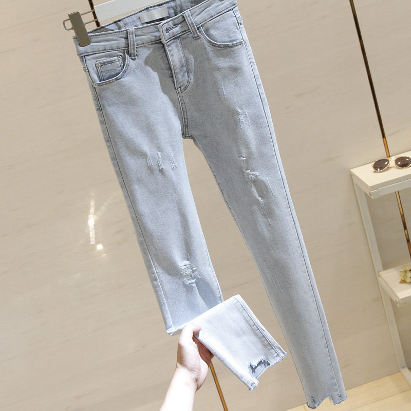 South Korea's light blue ripped skinny jeans women's 2022 spring and summer new high waist slim trousers raw edge pencil pants