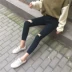 Mùa thu mới phiên bản Hàn Quốc của eo cao Joker Slim thun đen lỗ đen rách quần jeans ống quần nữ thủy triều quần jean lưng cao qua rốn Quần jean