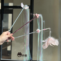 A weathered cat tennis red fairy teasing a cat baseball feather flowing water bell for a small magician teasing a cat-cat toy