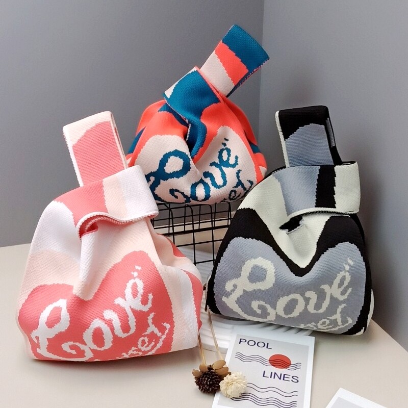 Korean ins niche design knitted love double bread bag new shoulder knitted bag black and white portable armpit bag