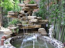 Real stone rockery waterscape garden Large rockery Small bridge Water flow Indoor outdoor rockery Pool water melaleuca stone fake