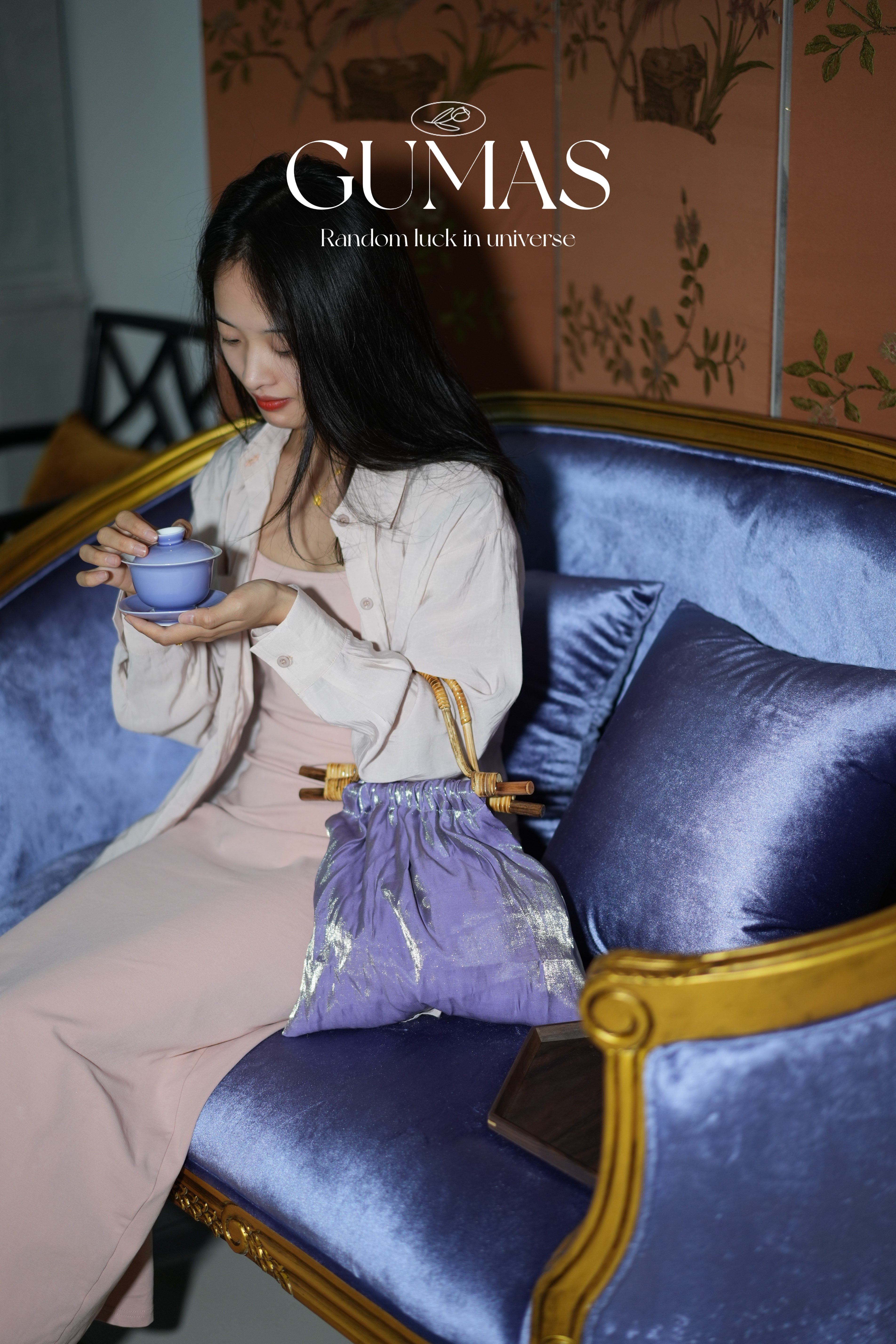 Bamboo handle detail wrapped in gold-tone decorative wire on lavender evening bag
