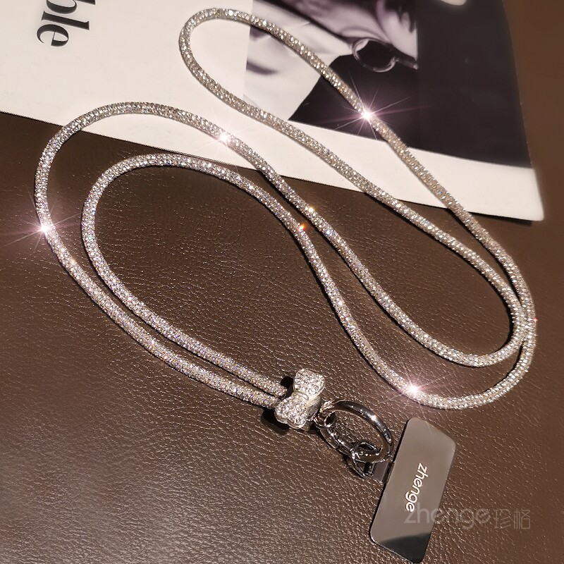 Long, stylish, high-end, luxurious phone lanyard with rhinestone chain, suitable for outdoor travel and has a sturdy case.