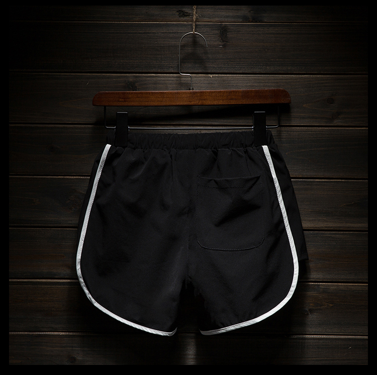 Quần short thể thao nam chạy theo dõi quần bên khe ba quần thể thao quần nam giản dị xu hướng hoang dã 3 điểm siêu ngắn quần the thao nữ form rộng