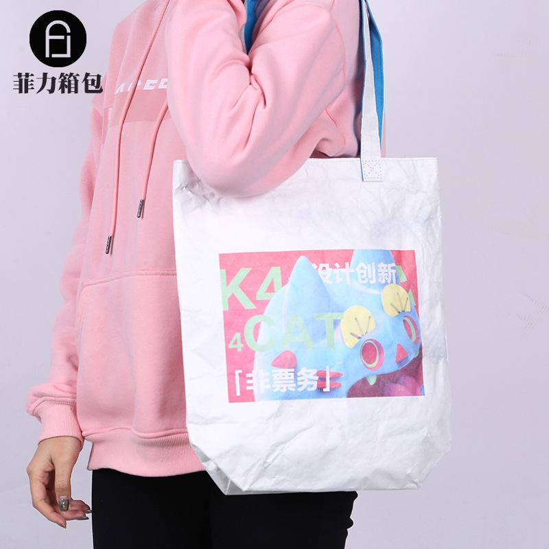 Manufacturers supply small fresh one-shoulder women's bag hand-tearable DuPont paper creative shopping bag can be customized logo