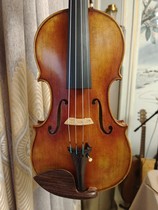 Le violon à la main dEustock imité Guannelly 1740 Heifetz violon usant dun instrument à cordes hors de la boîte