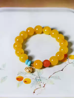 Rare orange mineral material chicken oil Red Gold Bell can ring far away jewelry natural beeswax bracelet ML994