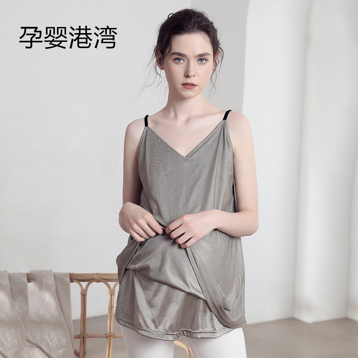 Radiation-resistant clothing worn by pregnant women The pregnant woman in office is wearing a harness vest for summer in an isolated coat of work