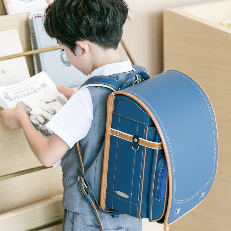 Korean cup bear high-end private custom schoolbag for primary school students shockproof and anti-drowning shoulders aristocratic backpack hand-stitched