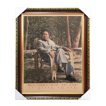 There is a frame of Chairman Mao sitting on a rattan chair in Lushan. Mao Zedongs retro hanging Image wall painting is a decorative painting mural