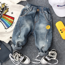 Spring and autumn new boys and girls baby R-shaped buckle hole jeans tide childrens small pants denim blue trousers