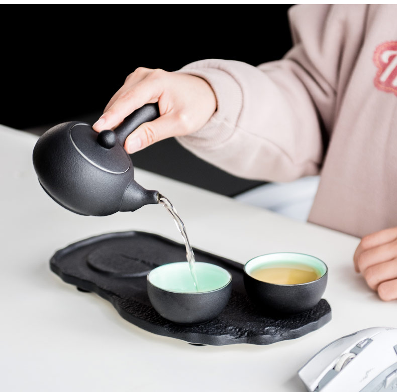 British green side between ink pot of Japanese kung fu tea set ceramic teapot set with a pot of tea tray two cups