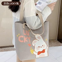 Серый счастливый кролик