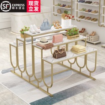 A five-layer rack is placed in the middle of the clothing store running water table